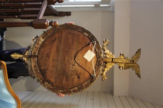 A large Regency circular gilt convex wall mirror, 4ft 10in. x 2ft 7.5in.